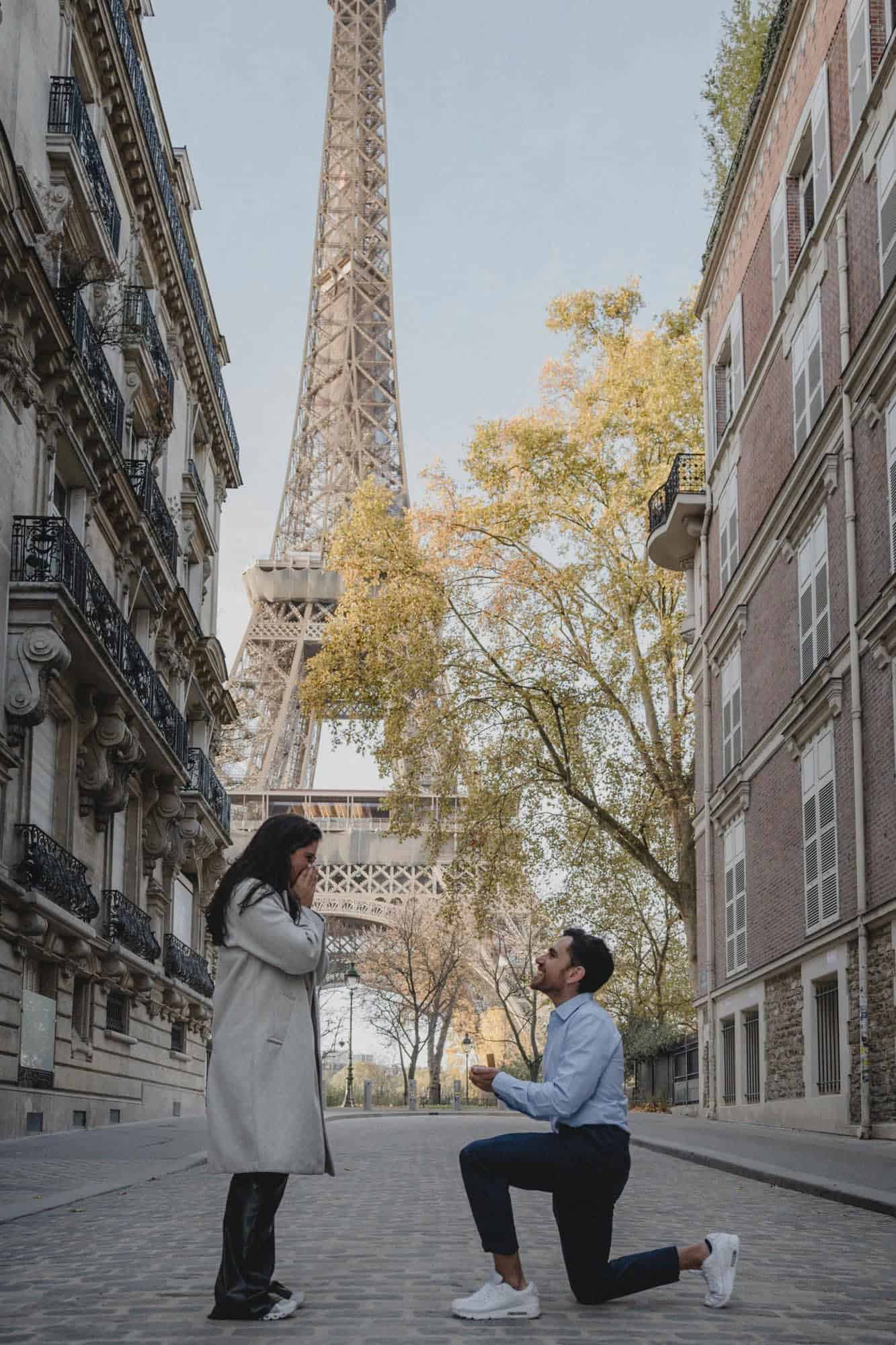 Surprise proposal on Rue de l'Universite with Eiffel Tower